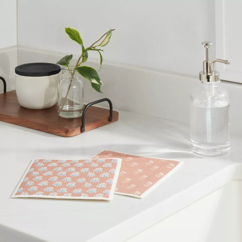 The patterned pink paper towels on a white tabletop