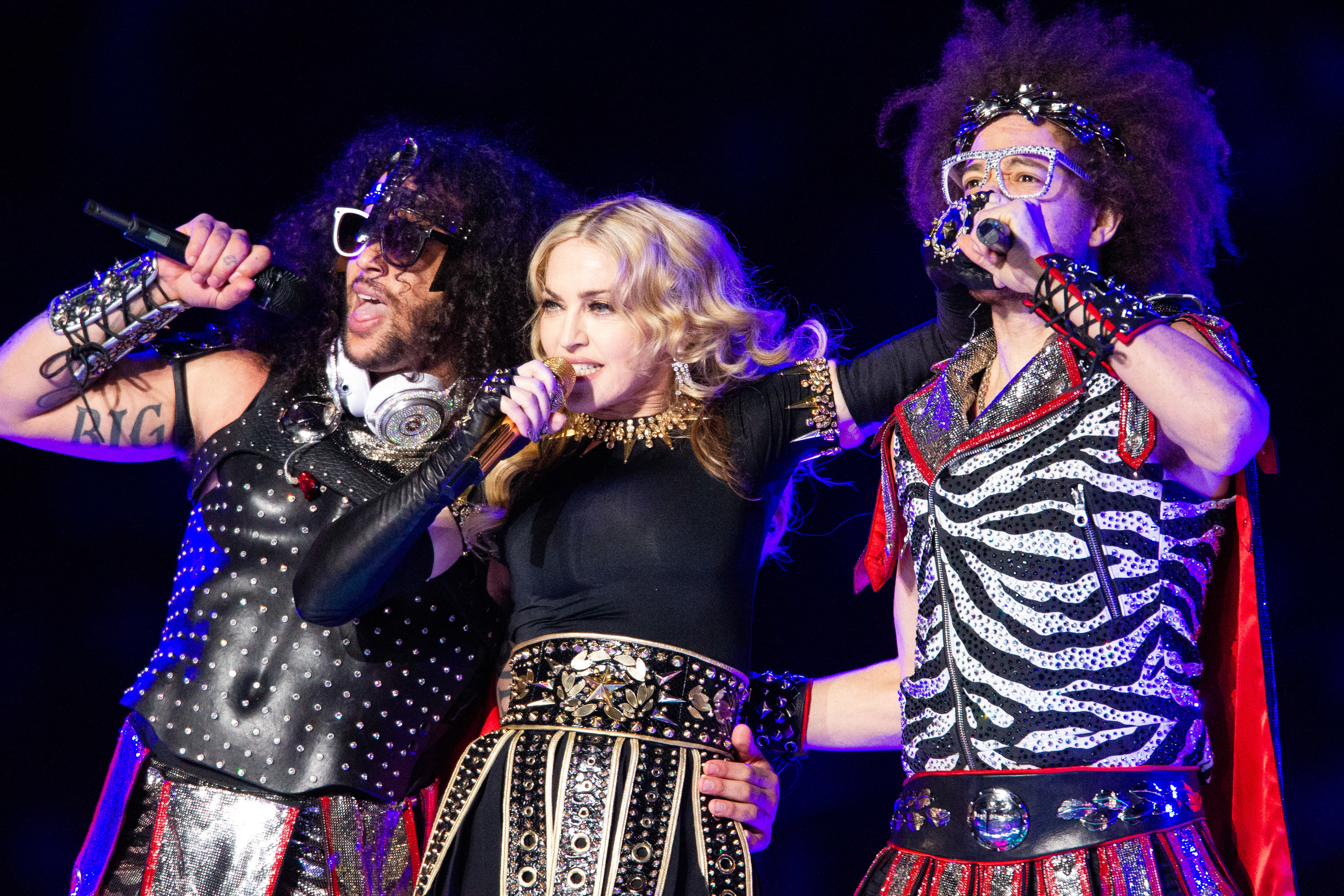 Madonna performs with LMFAO members SkyBLU and Redfoo during the half time show at Super Bowl XLVI