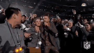 Justin Timberlake dancing with people in the crowd during his Super Bowl performance