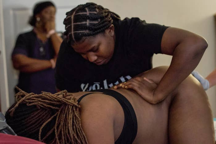 A doula assists a woman during labor