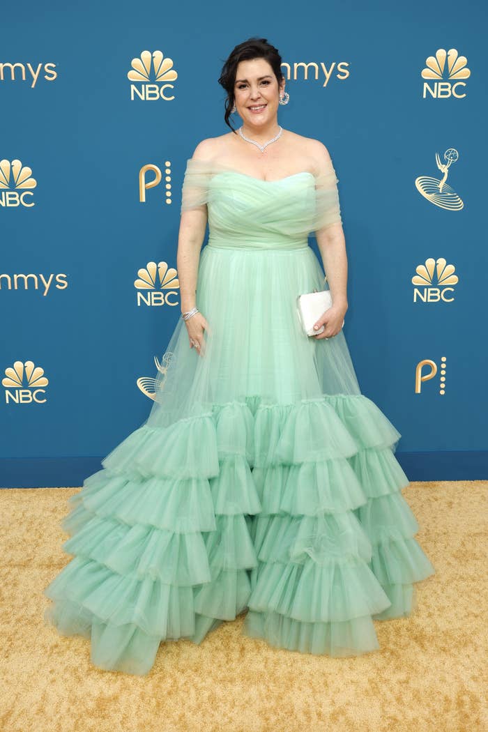 Melanie on the red carpet in a strapless gown with cascading ruffles