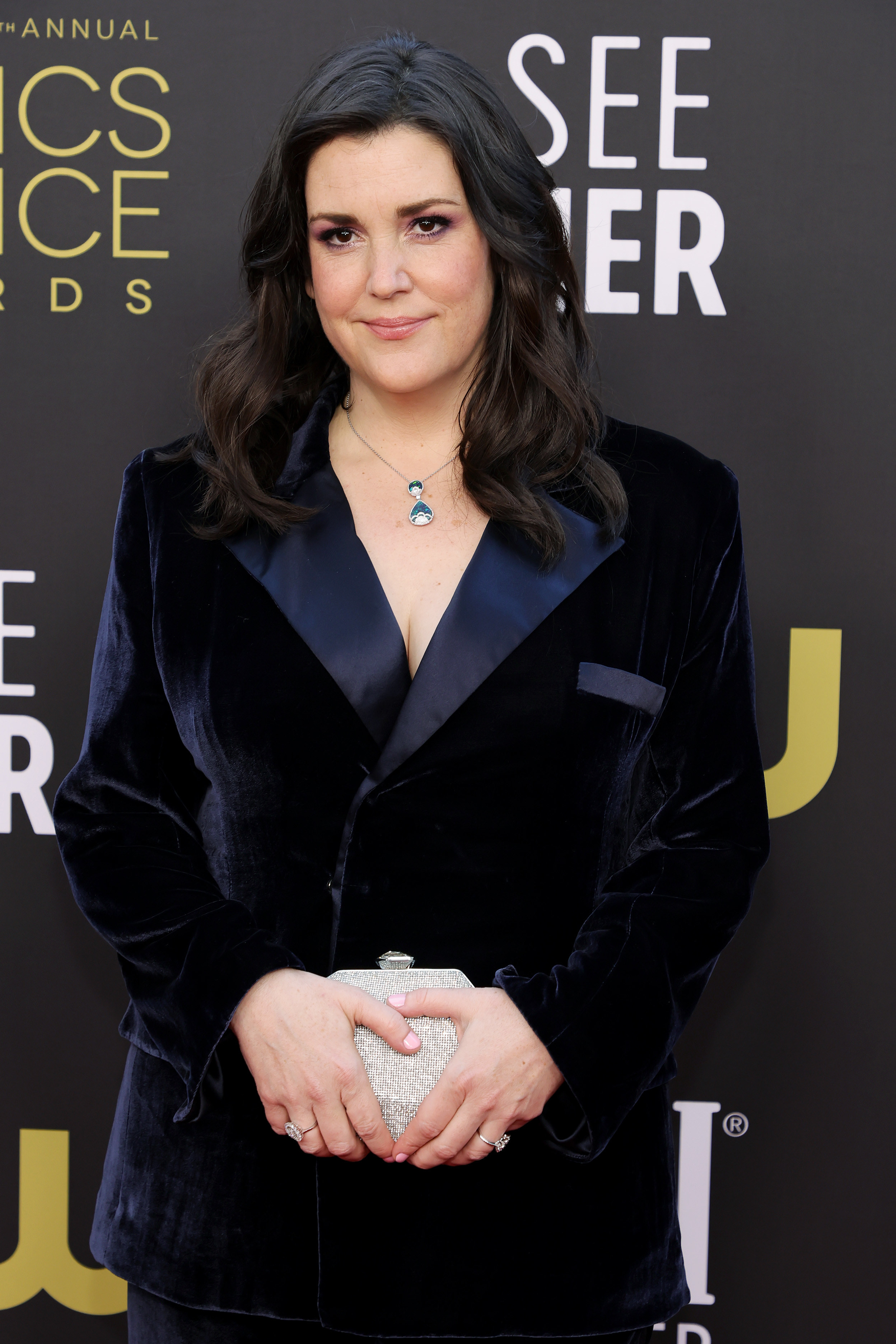 Melanie in a velvet suit jacket on the red carpet