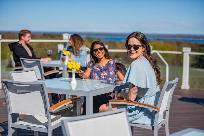 Two women enjoy glasses of wine at Brys Estate in Traverse City