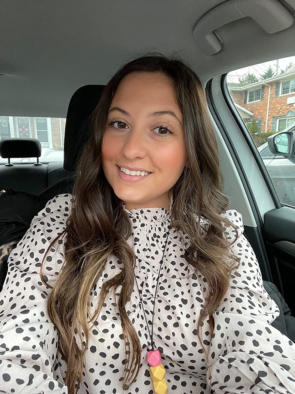 Reviewer wearing  black and white top