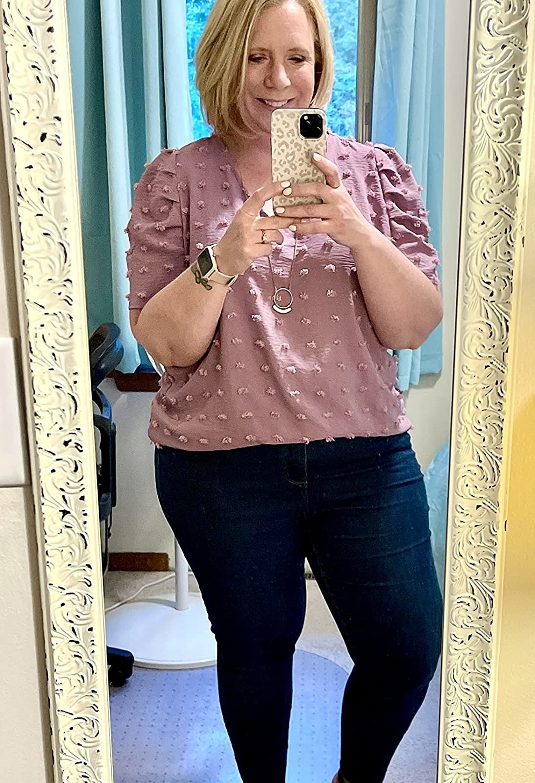 Reviewer wearing mauve top with jeans
