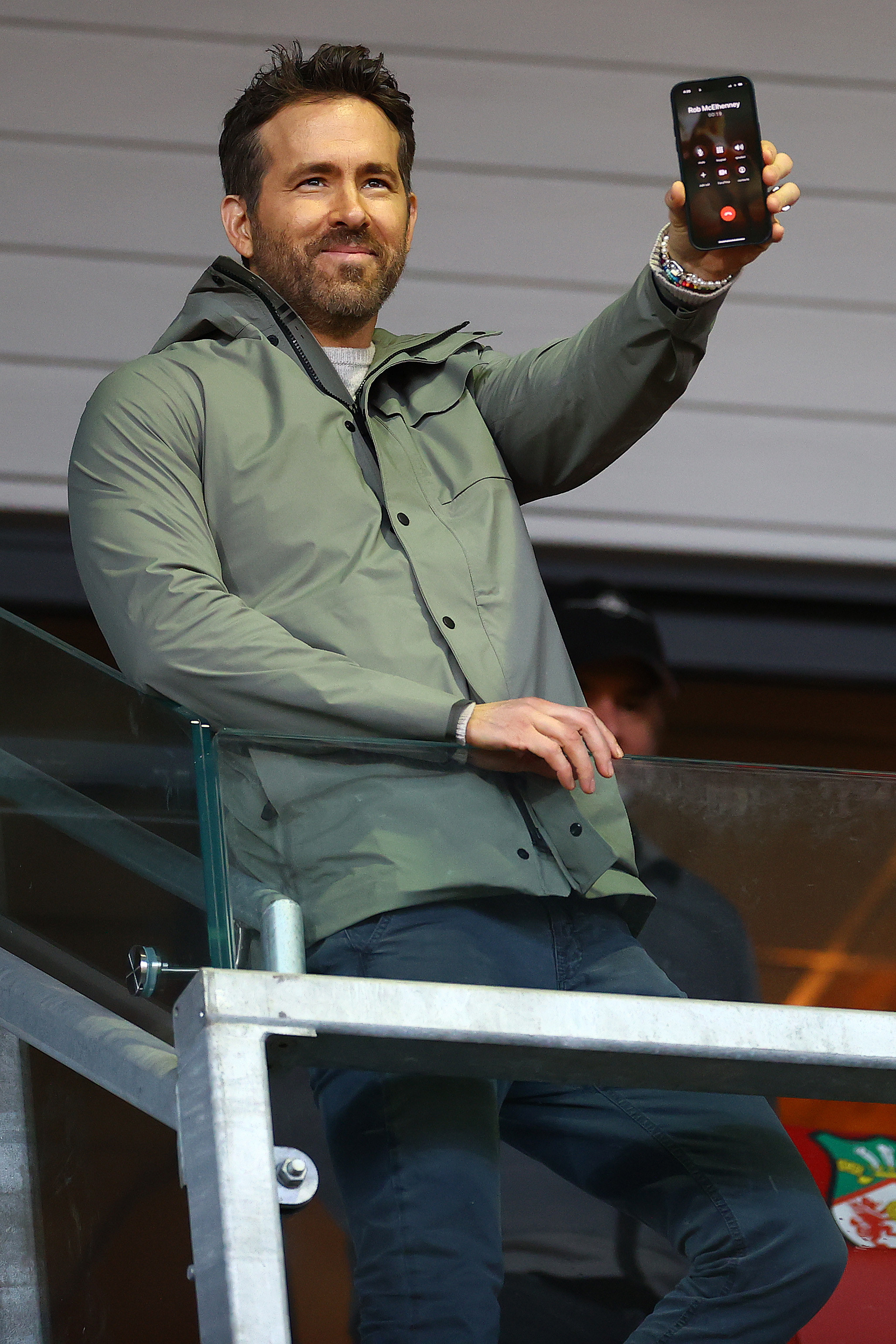 Ryan holding out his phone during a game