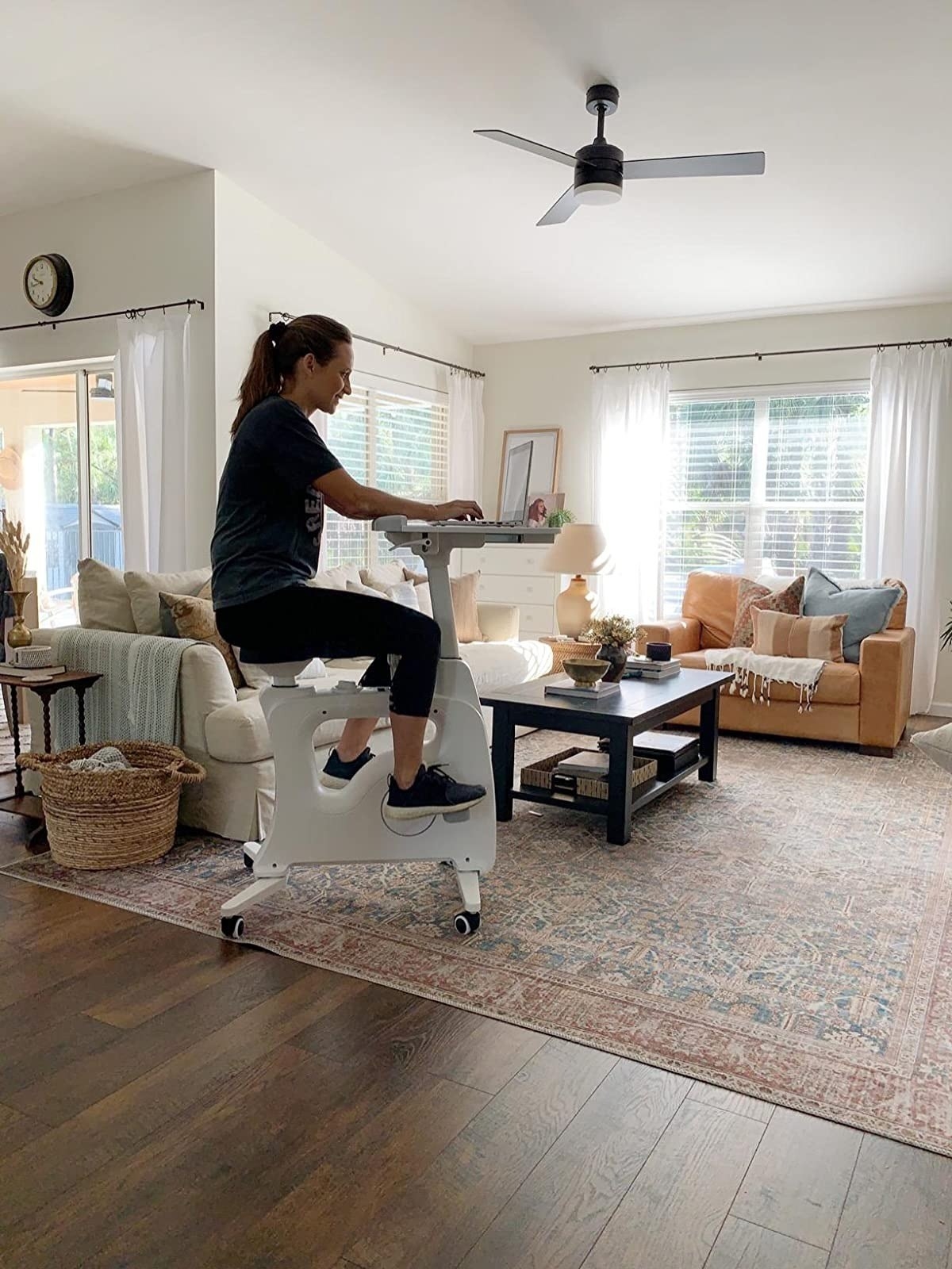 a reviewer sitting on the desk bike