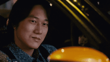 Sung Kang as Han smiles in Tokyo Drift