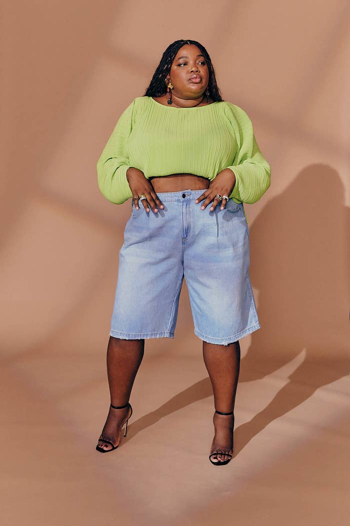 the green crop top with denim bermuda shorts