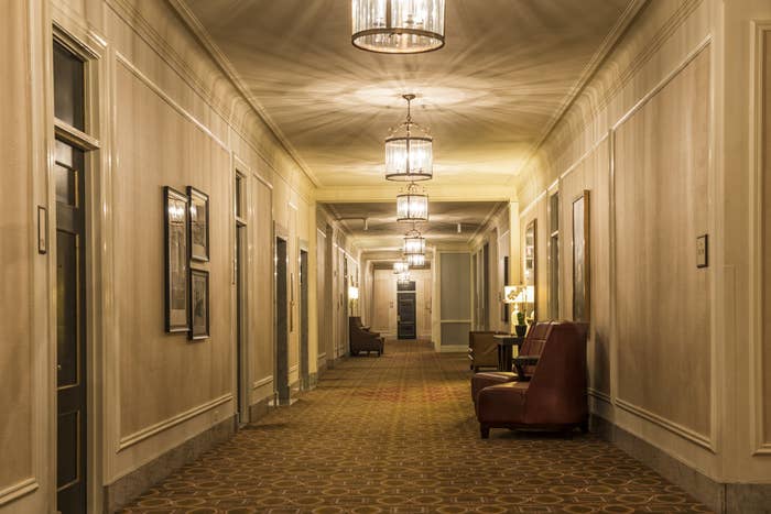 A long hallway in an old hotel