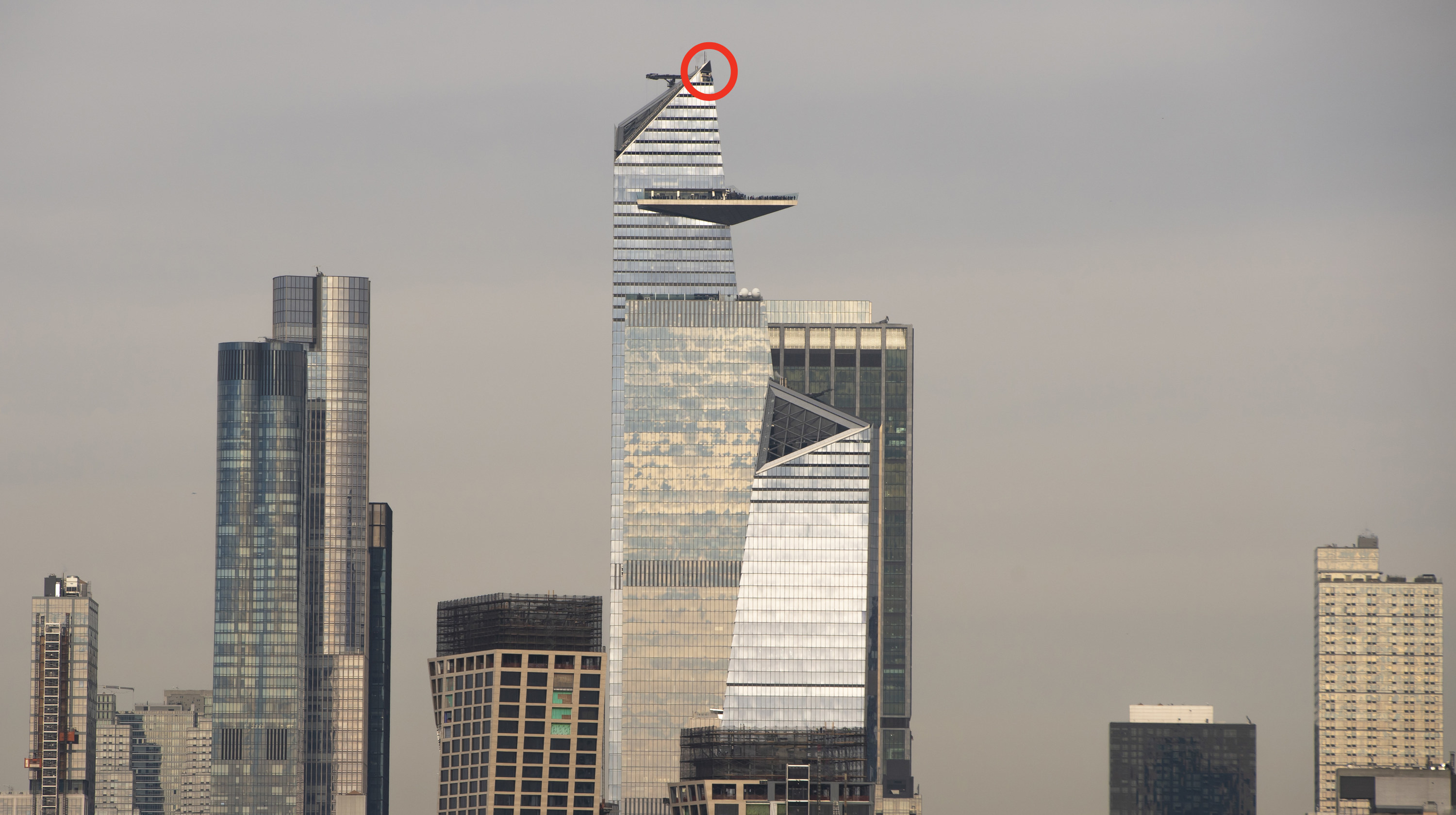 A wide view of the skyscraper, with the area at the top of the diagonal climb circled