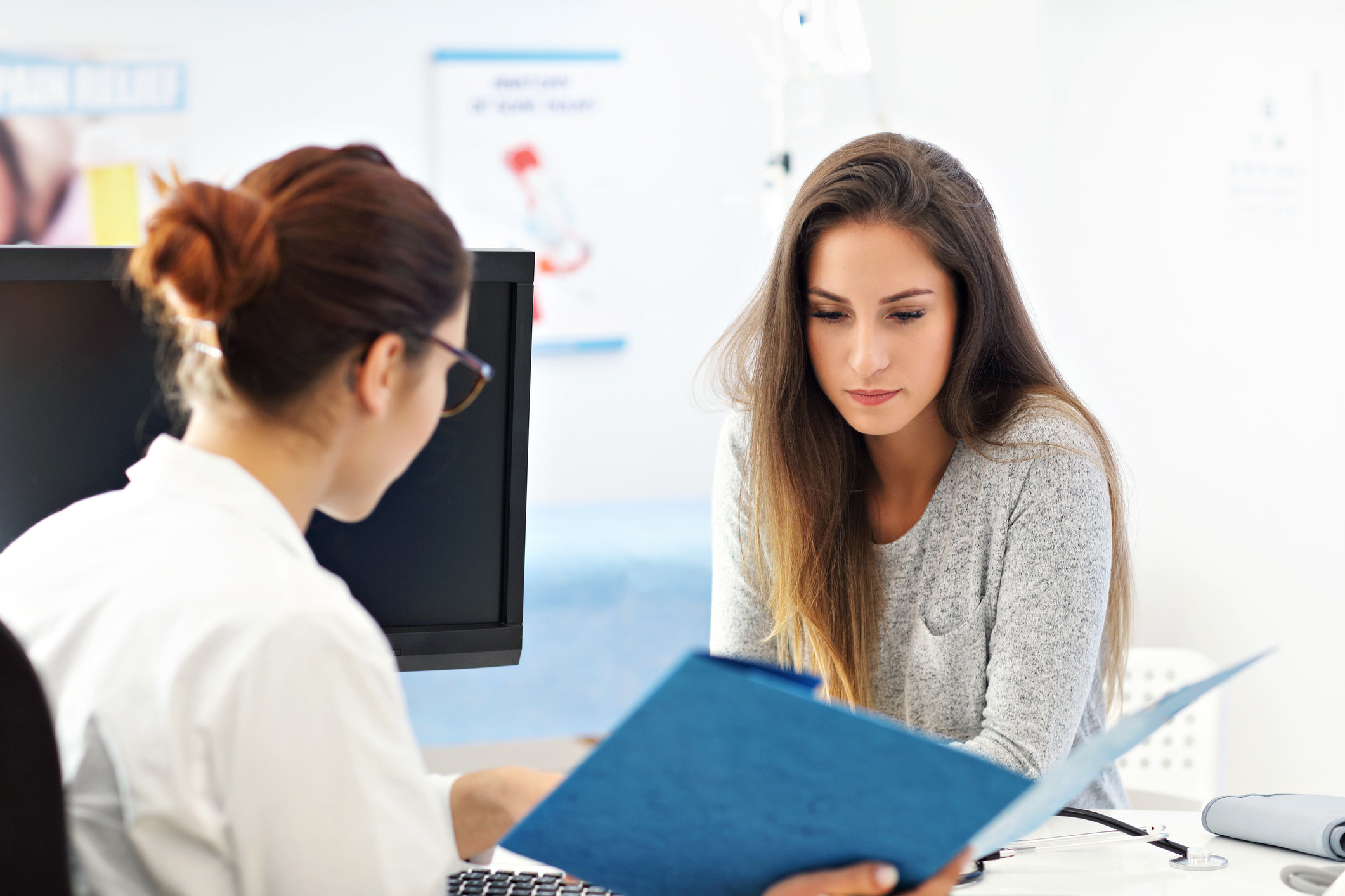 A woman speaking with her doctor