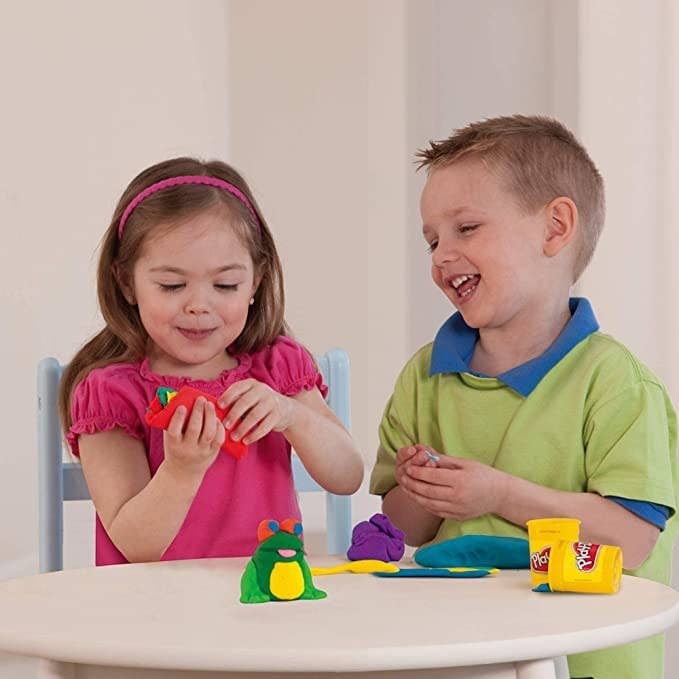 Two kids playing with Play-Doh
