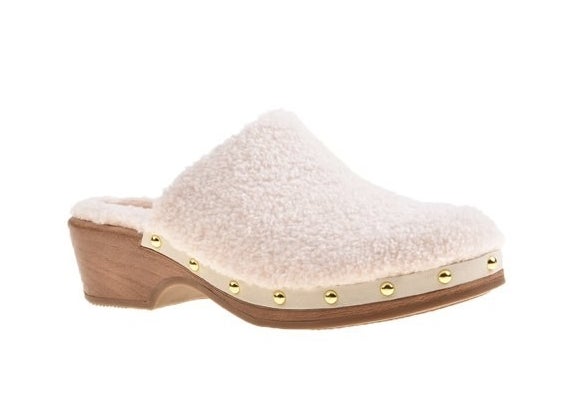 A white fuzzy pair of clogs with brown sole and gold studs