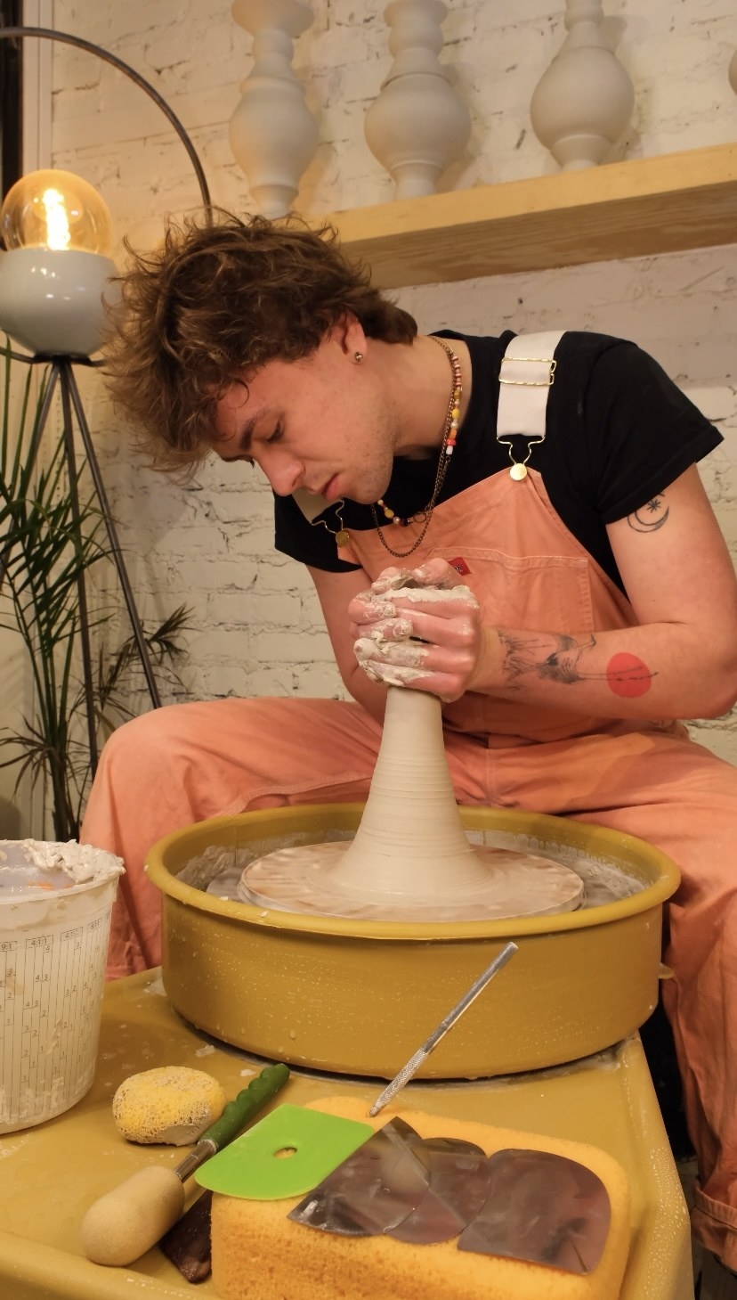 Oliver Elias doing pottery