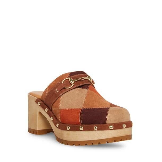 A pair of brown patchwork clogs with brown heel and studs