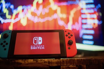 In this photo illustration, a Nintendo Switch displays the Nintendo Switch logo