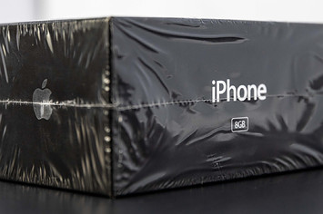 iPhone in original sealed condition at auction