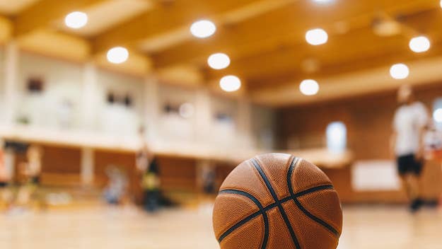 A Virginia high school basketball coach has landed himself in hot water after he was captured on video launching himself at a spectator in the stands.