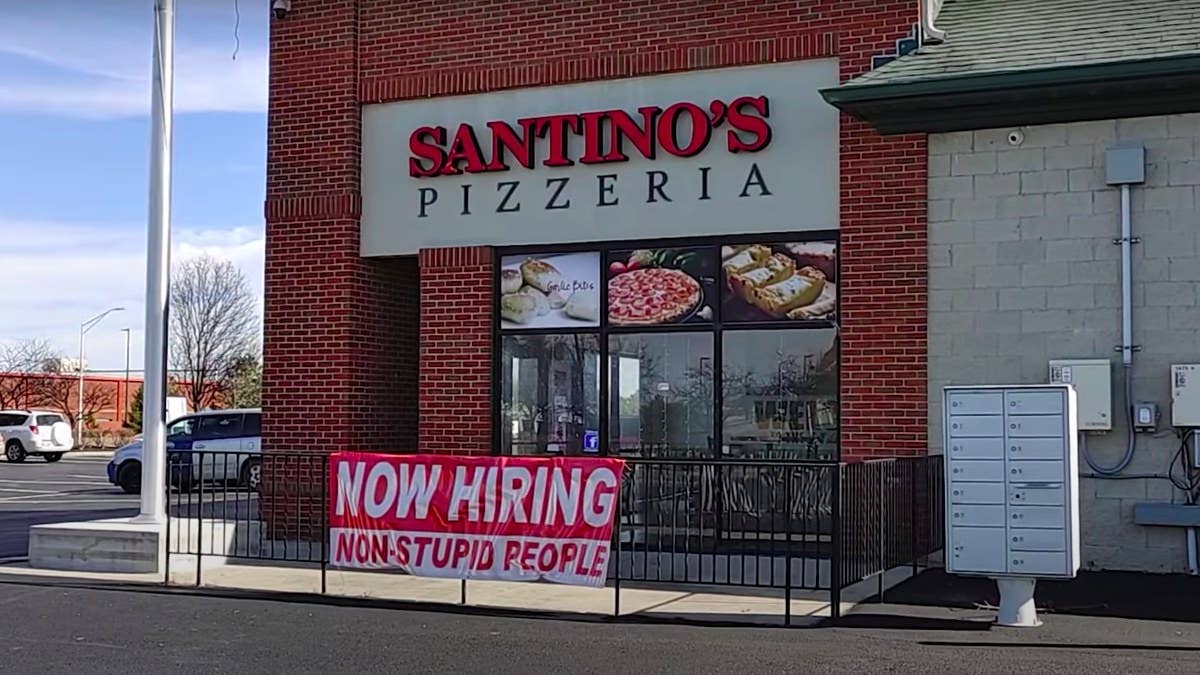 The sign made its first appearance outside the Ohio pizza shop several months ago. The attention on it, however, has now grown to a national level.