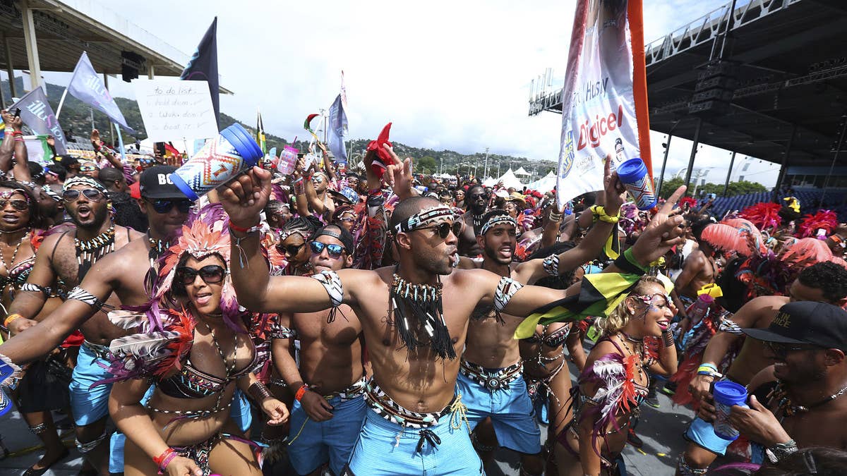 After two COVID-dampened years, Trinidad and Tobago's Carnival returns to full strength with Wizkid, Shenseea, and tens of thousands of revelers.
