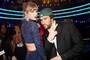 Taylor Swift and Bad Bunny pose during the 65th GRAMMY Awards