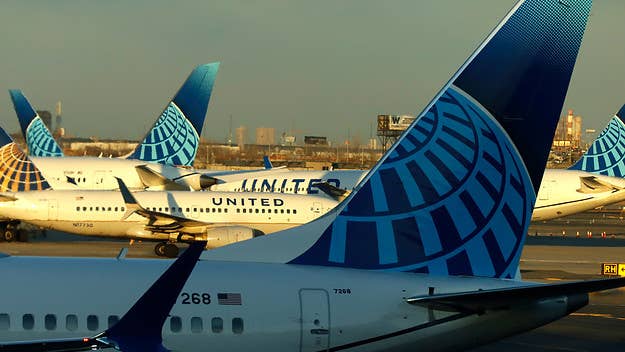 Four people have been hospitalized after an external laptop battery ignited and caused a fire on a United Airlines flight on Tuesday, CBS News reports.