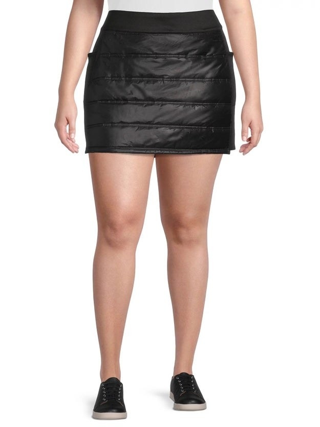a model wearing the black skirt