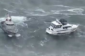 Coast Guard video from the rescue shows the vessel, at right, in distress.