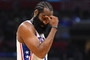 James Harden reacts to a timeout during a NBA game.