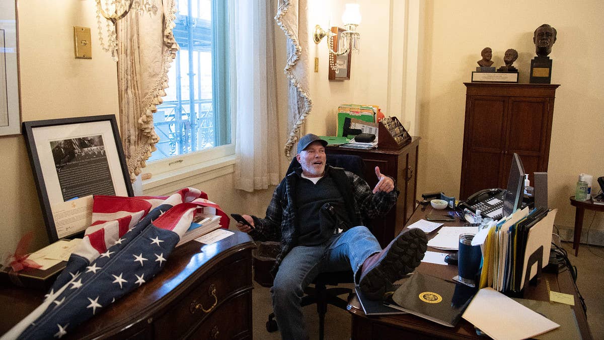 The man who was infamously photographed sitting in Pelosi's chair and putting his feet on her desk during the Jan. 6 Capitol riot has been found guilty.