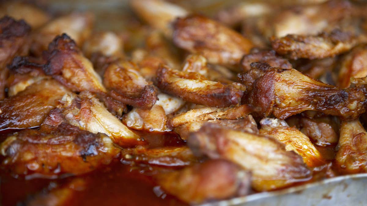 A former official at a suburban school district near Chicago has been accused of stealing $1.5 million worth of food, comprised primarily of chicken wings.
