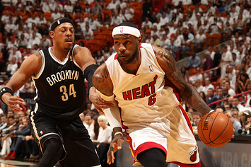 LeBron James #6 of the Miami Heat drives against Paul Pierce #34 of the Brooklyn Nets in 2014