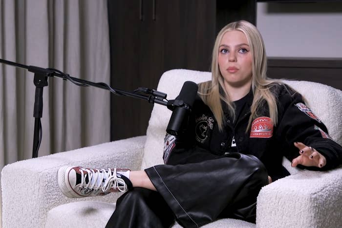 Reneé sitting on the couch during the interview