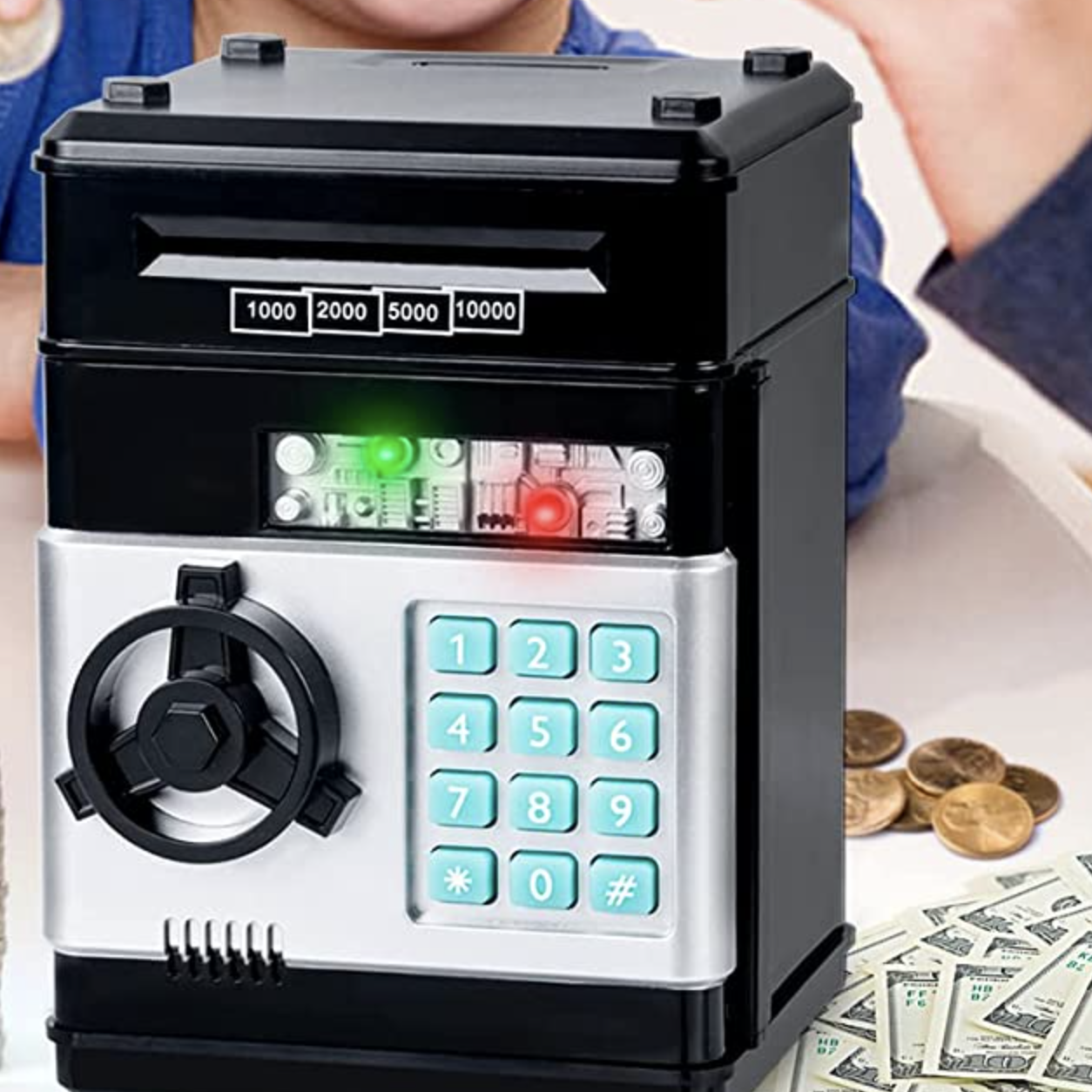 the safe on a table surrounded by coins and paper money