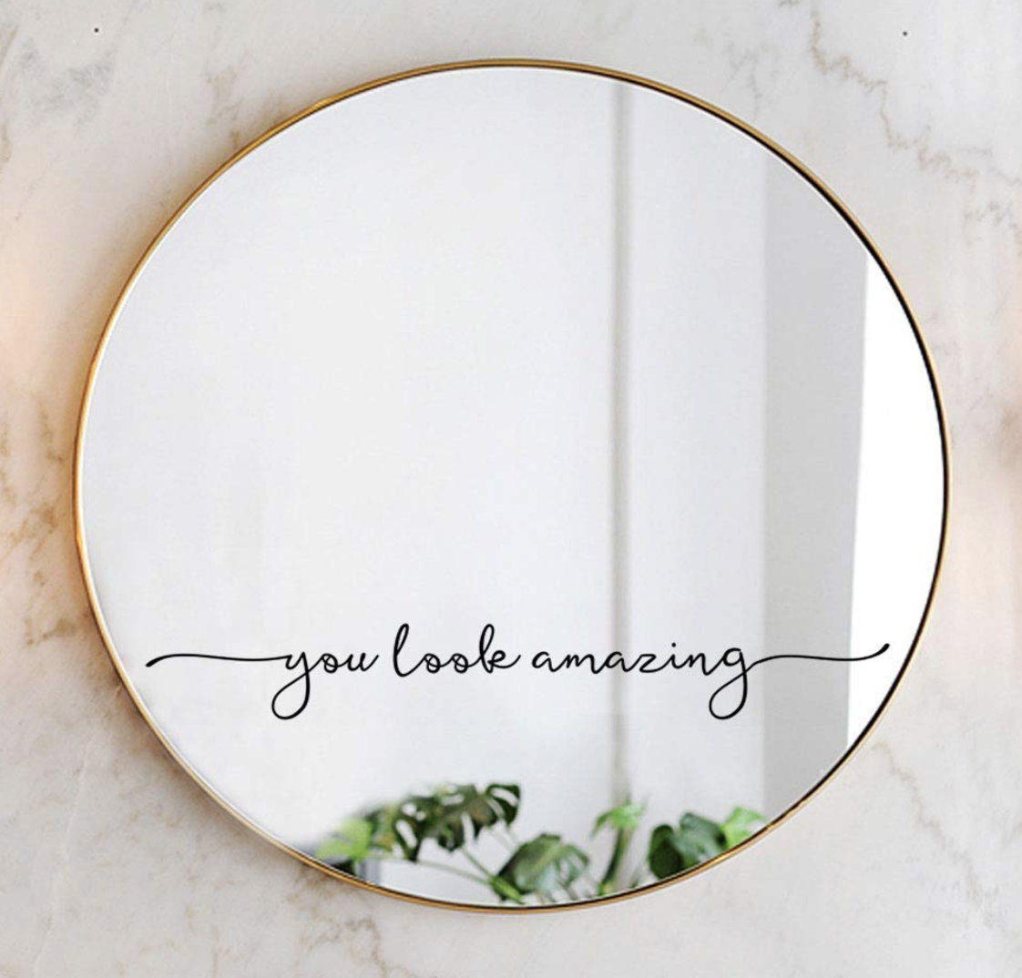 the decal that says &quot;you look amazing&quot; on a circular mirror