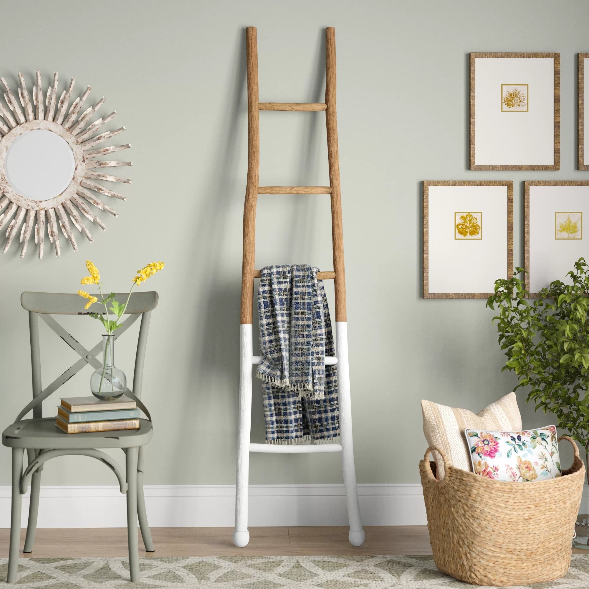 The ladder with a white dipped bottom holding a blanket in a living room