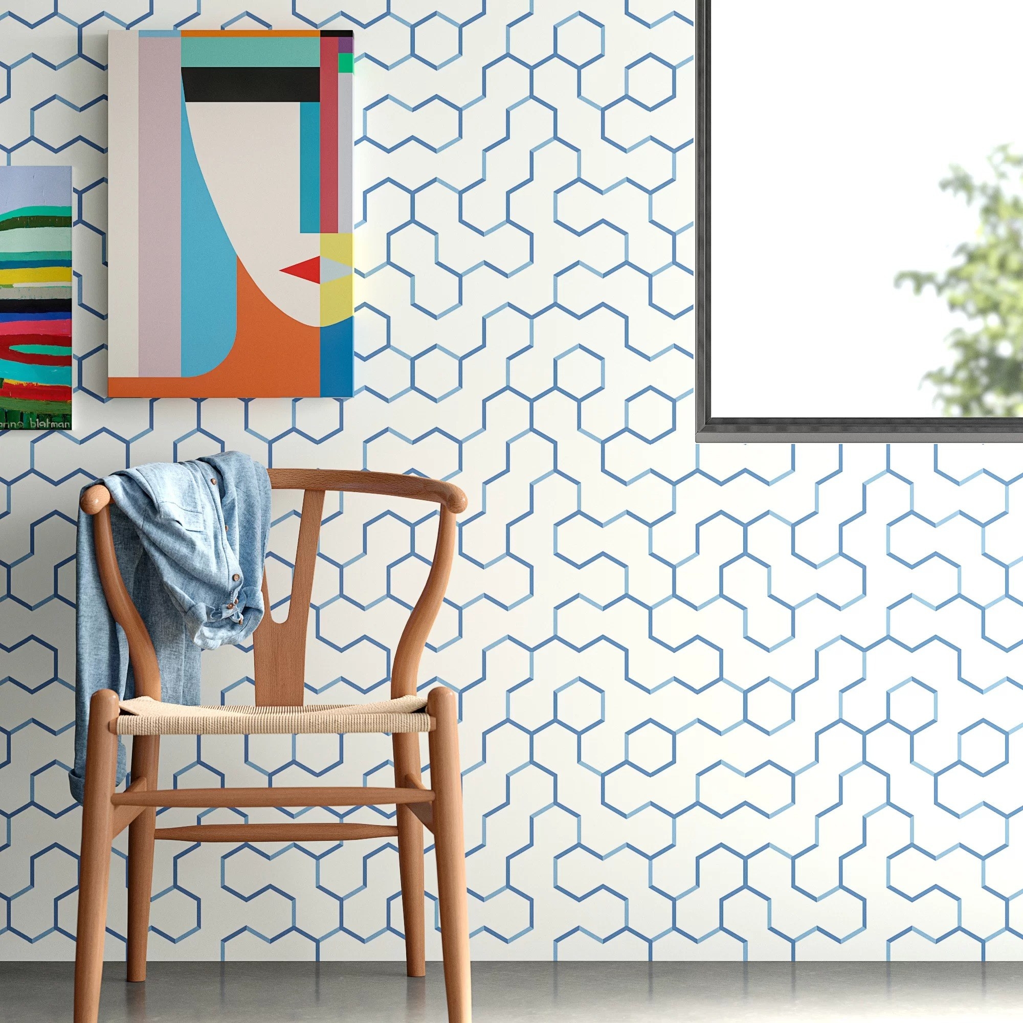 The blue and white wallpaper with a geometric pattern on a living room wall
