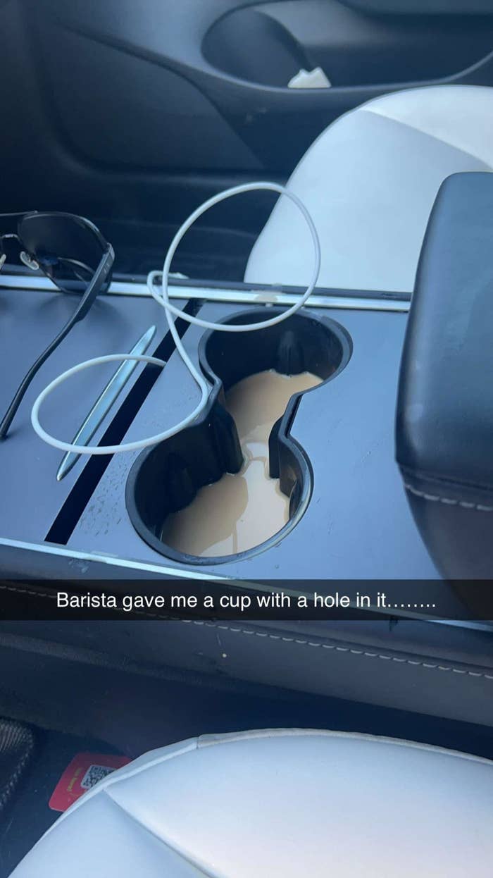 center console in a car filled with coffee
