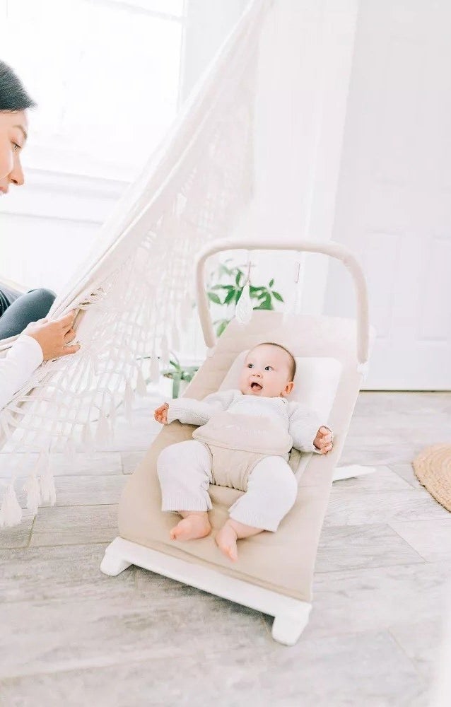 a baby in the bouncer