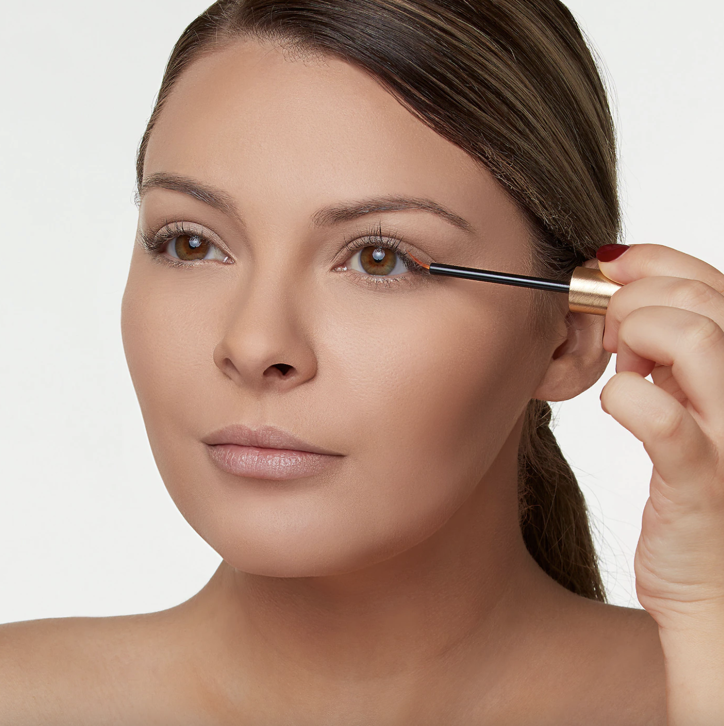 a person applying the serum to their lash line