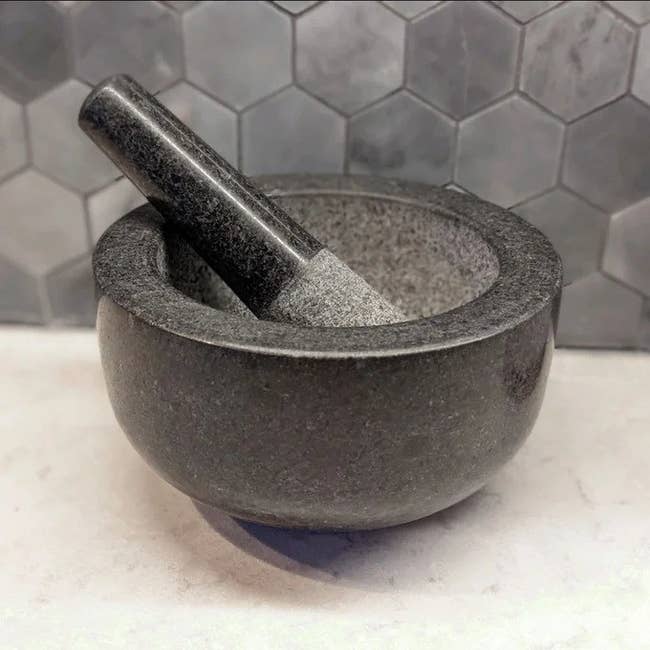 The mortar and pestle connected a room countertop