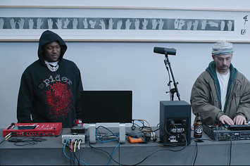 Hit Boy and The Alchemist in the music video for "Slipping Into Darkness"