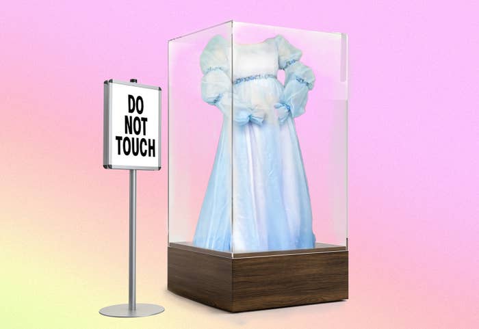 An illustration of a blue frilly vintage dress in a glass box next to a &quot;Do not touch&quot; sign