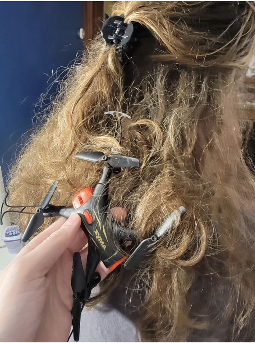 A small drone caught in someone&#x27;s hair