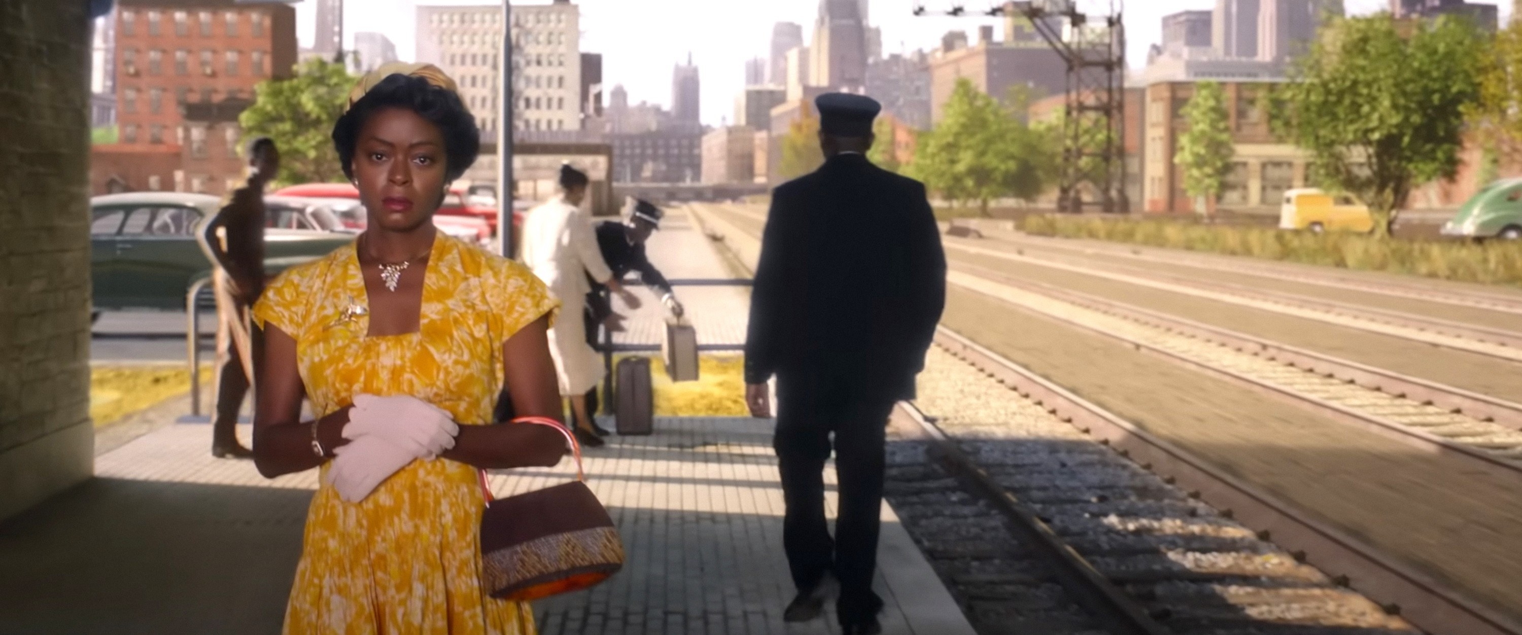 Mamie Till walking along a train platform