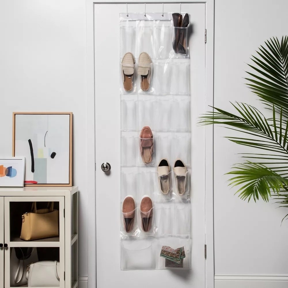 the clear shoe holder over a closet door
