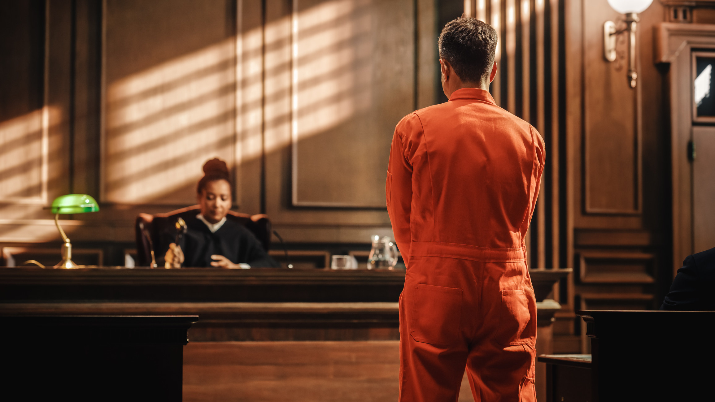 An inmate speaking to a judge