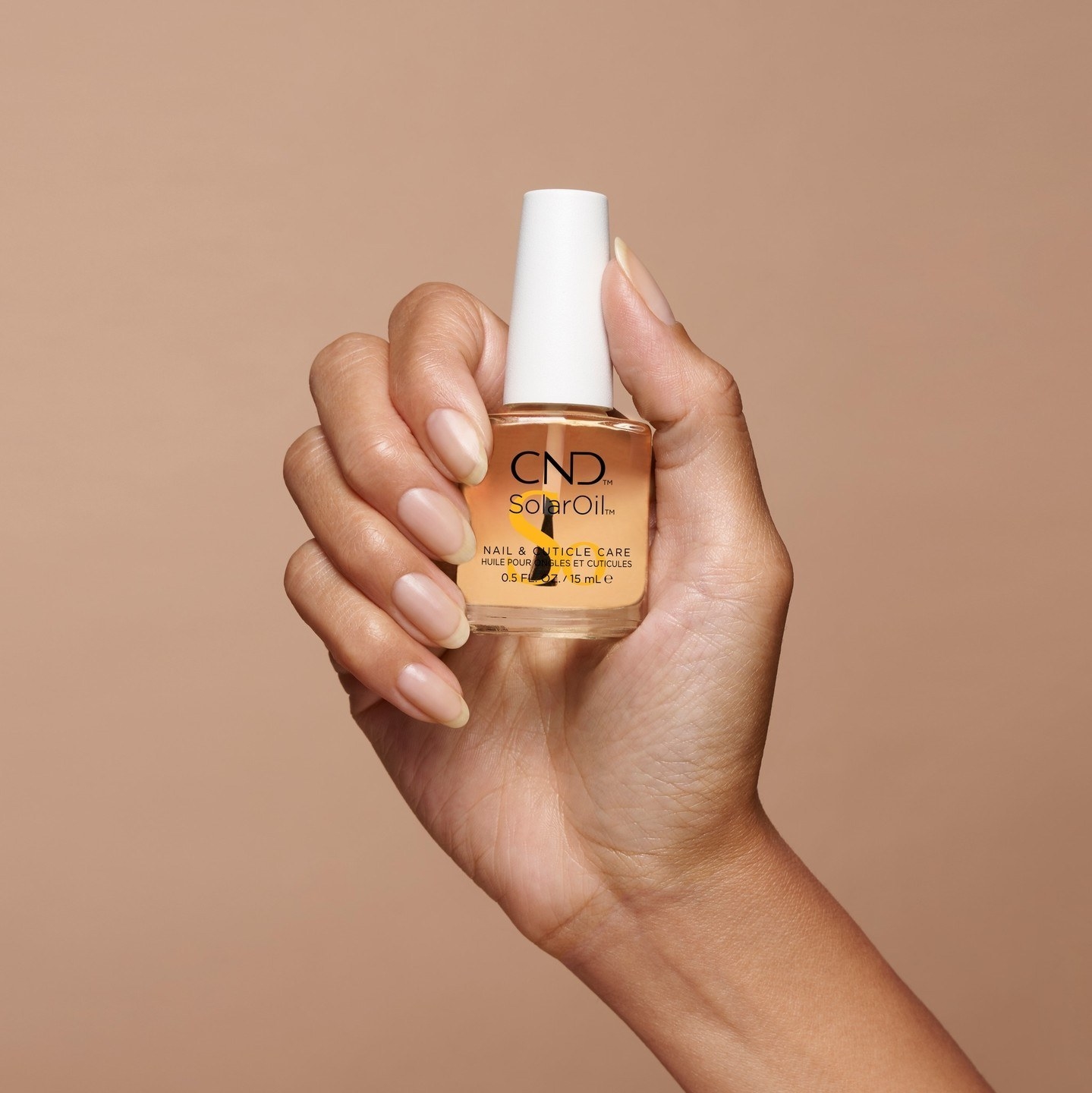 Model holding the cuticle oil