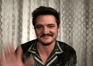 Pedro Pascal waving to audiences on a zoom call